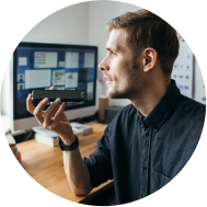 Man talking on the phone at a desk